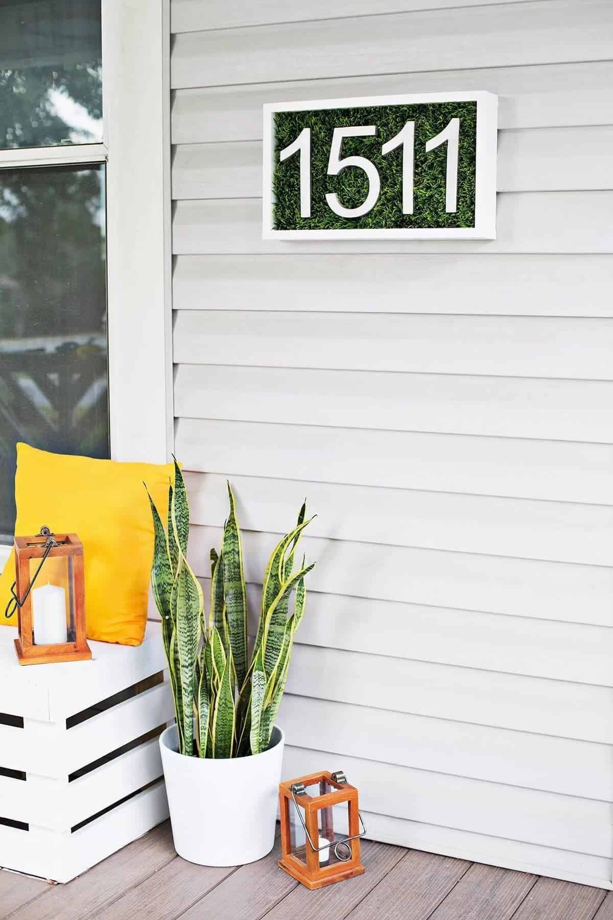 A Patch of Grass on Off-White Siding