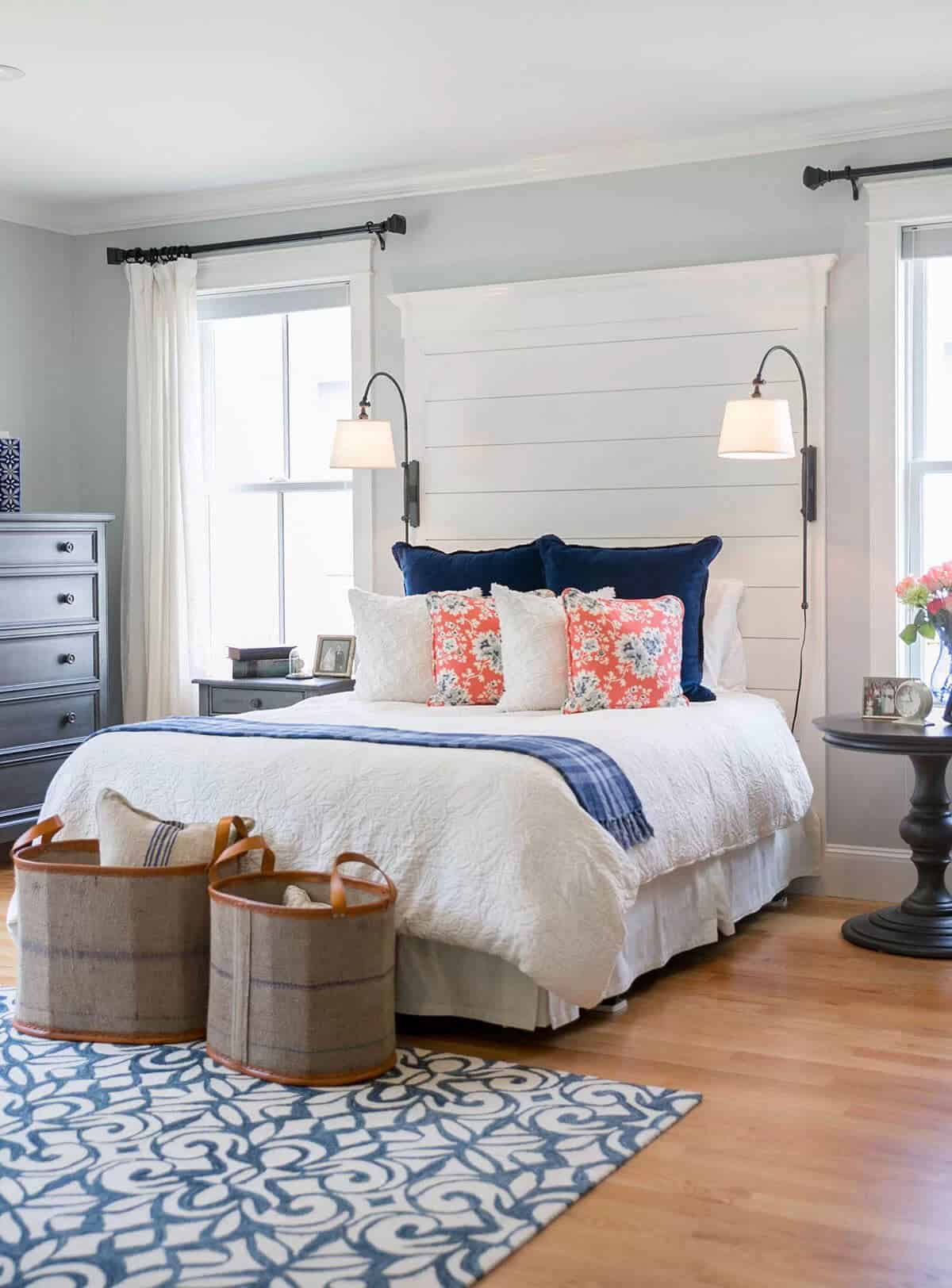 A Quaint Bedroom with Bright Accent Pillows