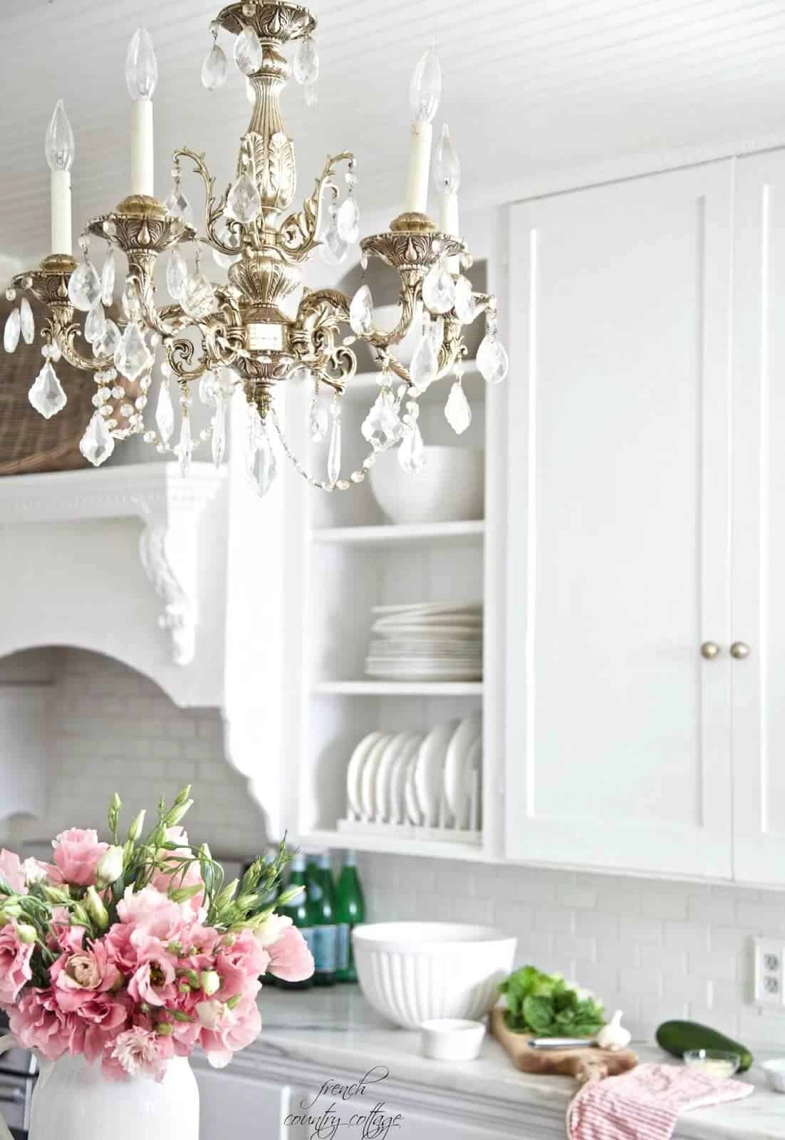 Silver and Crystal Chandelier with Wooden Cabinets