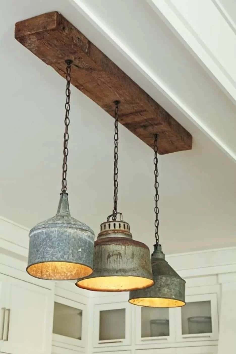 Antique Metal Fixtures Hanging from Timber Beam