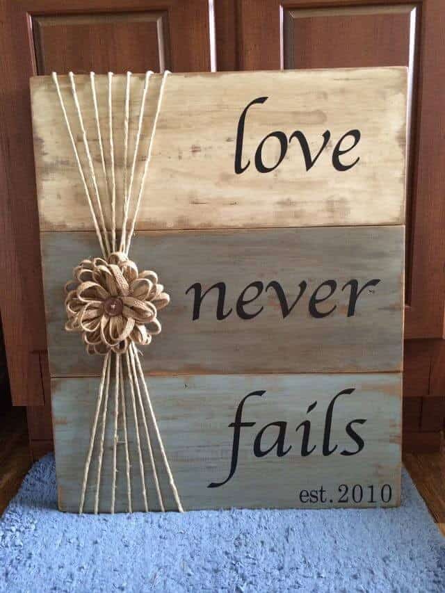 “Love Never Fails” Tri-Color Weathered Wood Sign