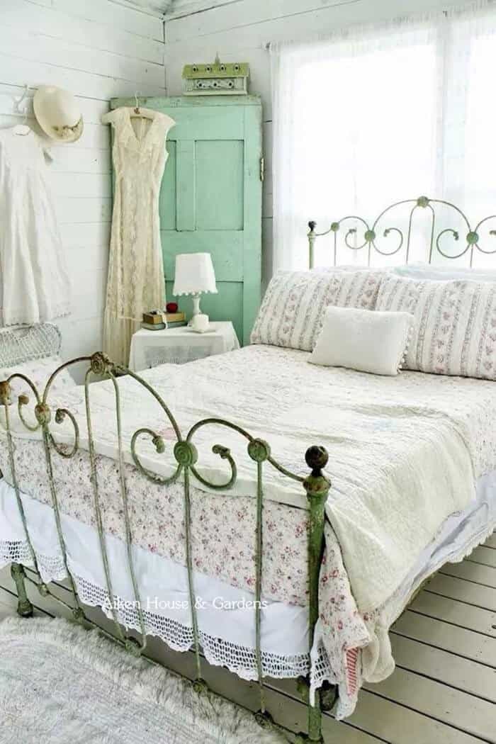 Rustic Brass Bedframe With A Light And Airy Color Scheme