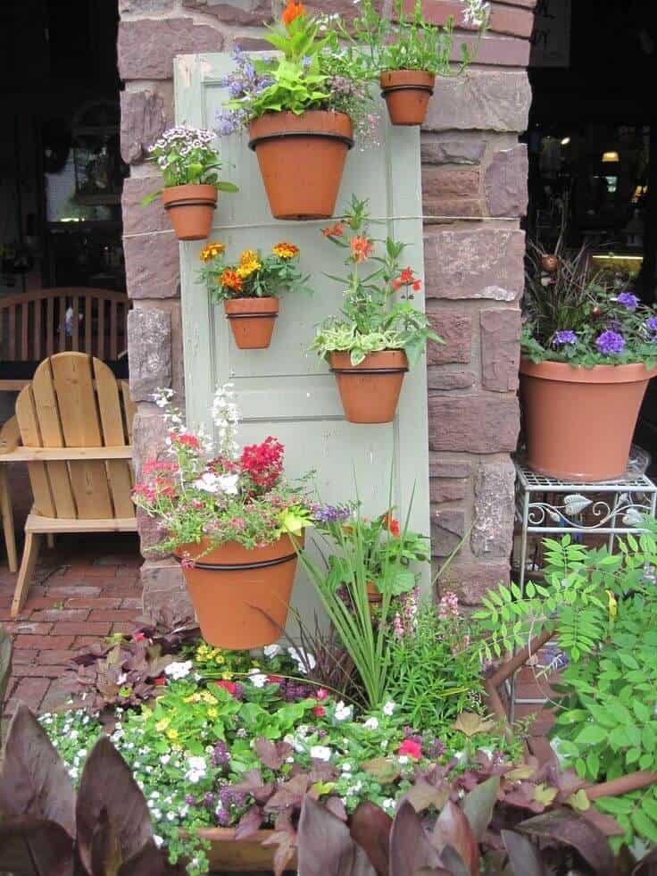 Terra Cotta Pots Hung From a Door