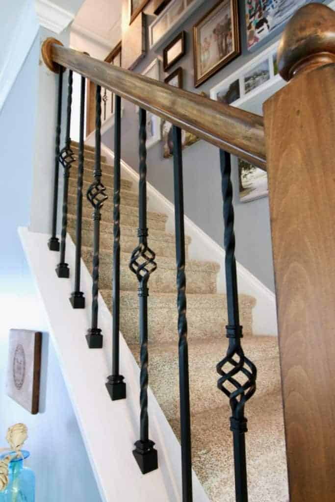 Intricate Metal Rails Against Wooden Bannister