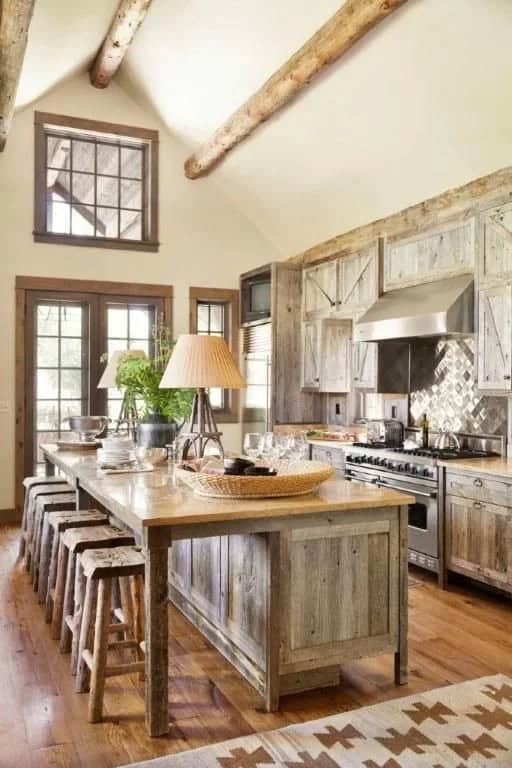 Weathered Wood Maximizes the Airy Space of a High-Ceilinged Rustic Country Kitchen Design