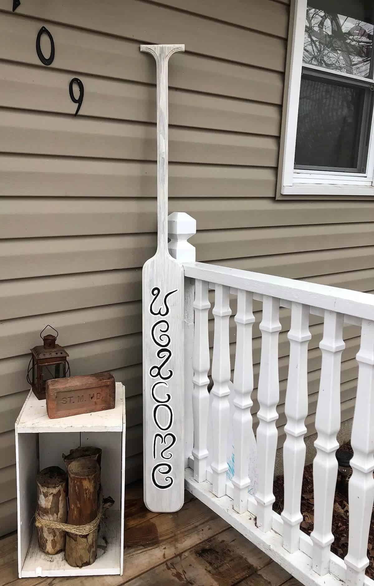 Whitewashed Wooden Oar Welcome Sign