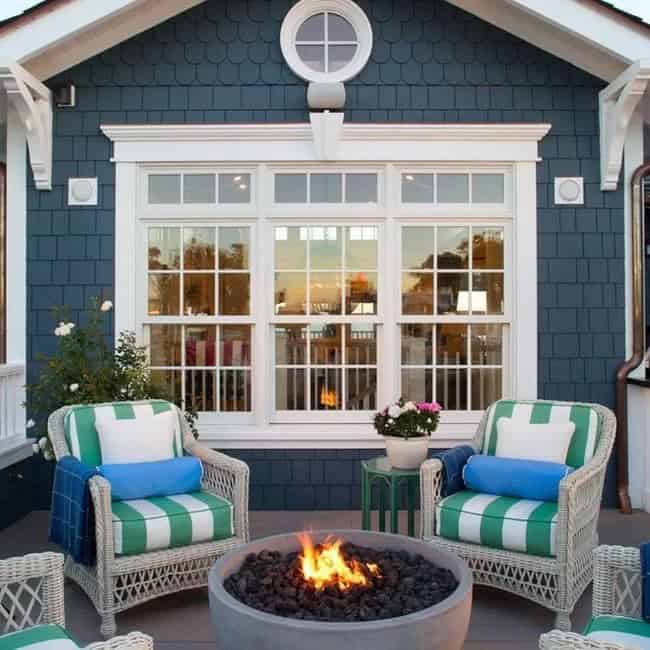 White Wicker With Bright Pillows are Perfect in This Cape Cod Style Setting