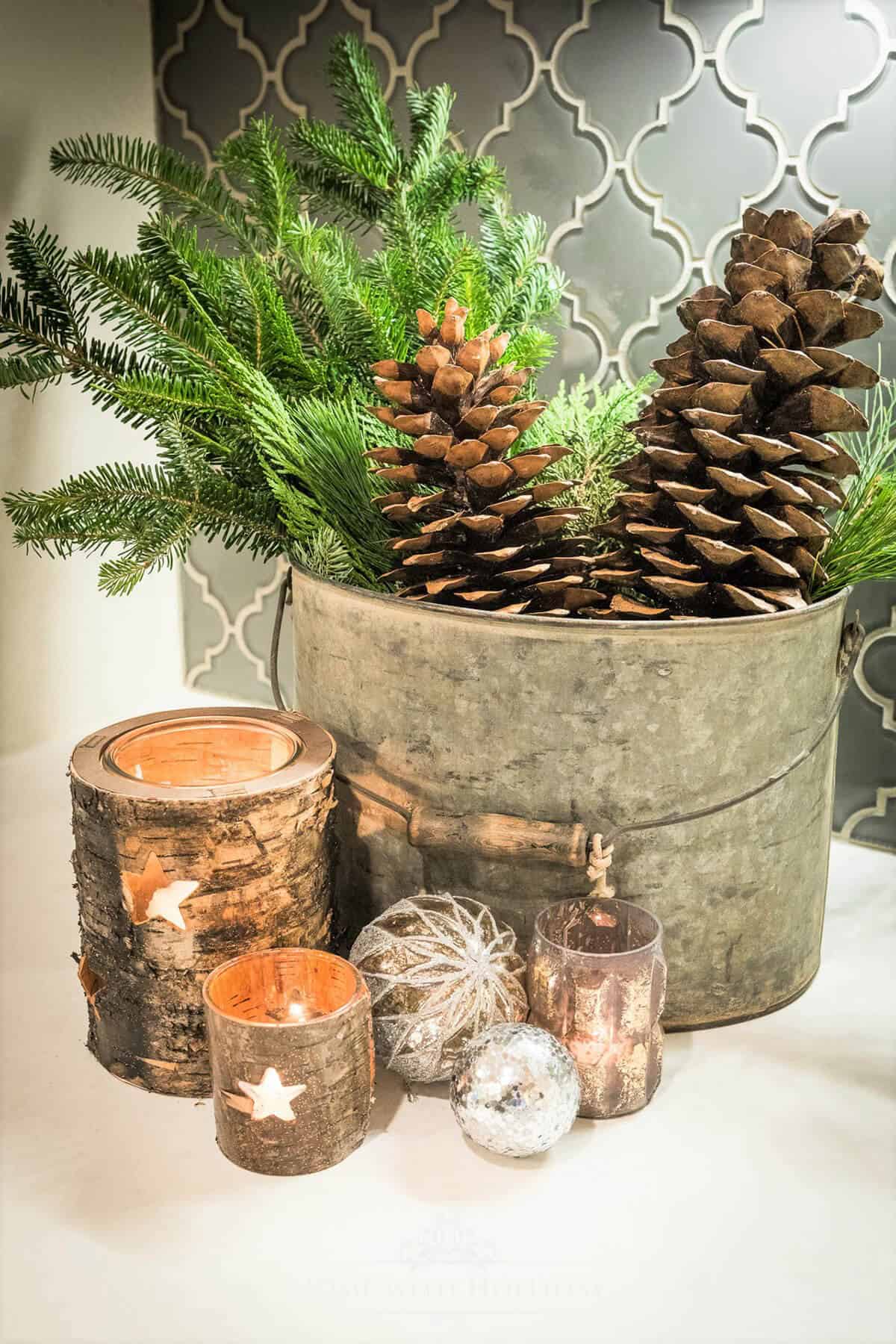 Pinecones, Candles, and Overflowing Buckets Decor