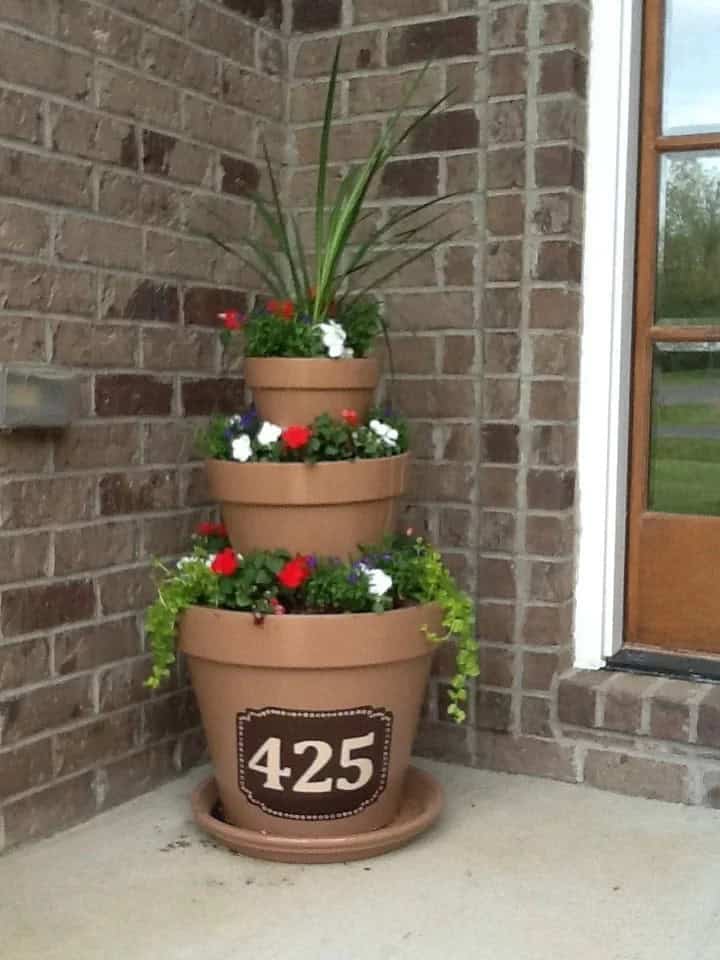 Terra Cotta Pots and Bright Green Plants Create a Playful Welcome